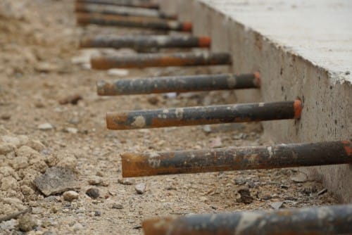 Dowel bars in concrete pavement installation guide for load transfer between adjacent slabs