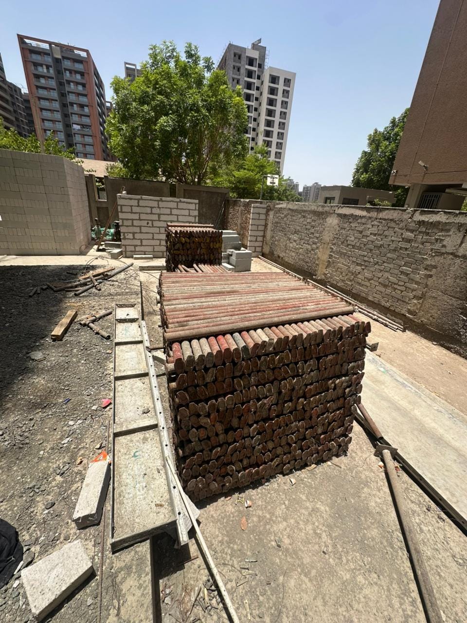 AMCO scaffolding supporting construction work at a residential site in Gujarat