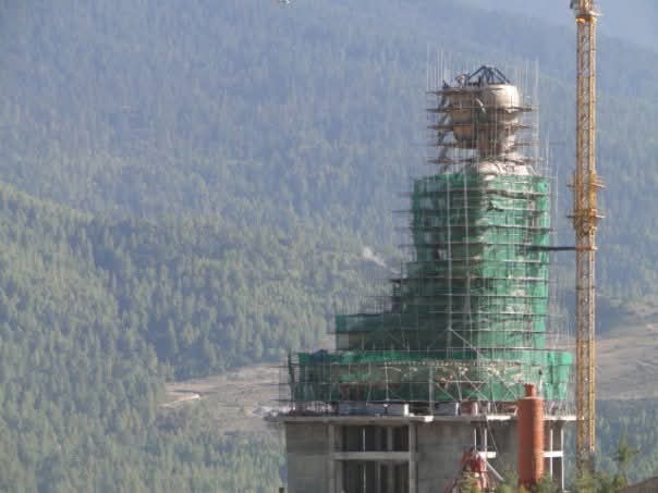 Bhutan construction site with scaffolding and safety netting